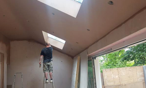 A plasterer doing plastering work in Croydon